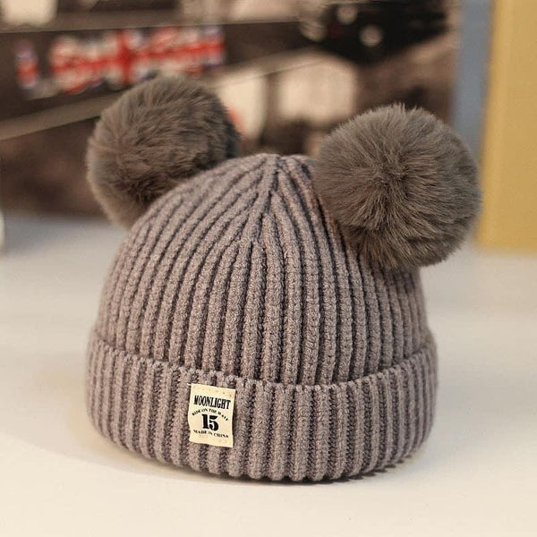 Gorro de invierno de punto para niña con pompón